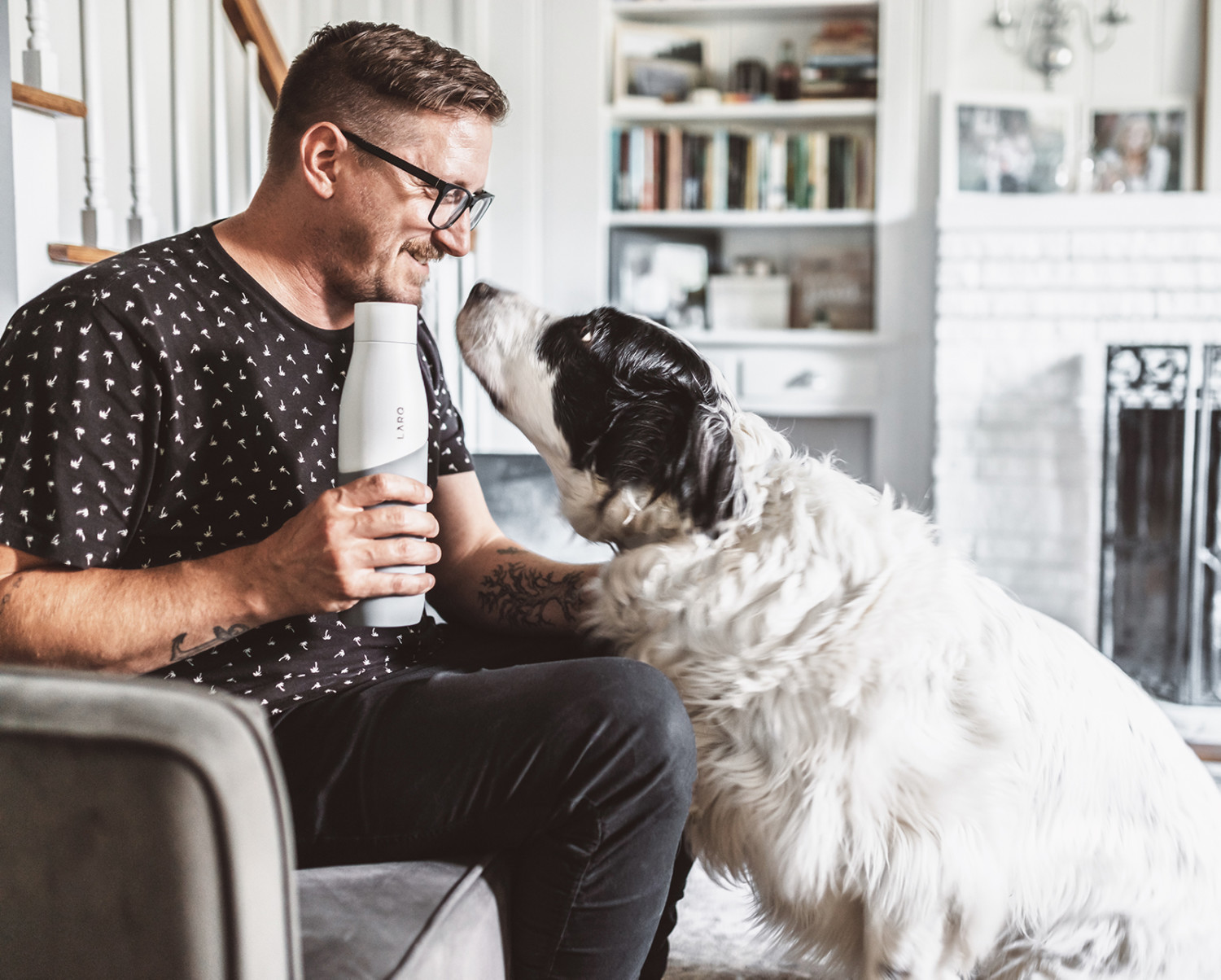 Tim Landis with dog and White/Pebble LARQ Bottle Movement Terra Edition