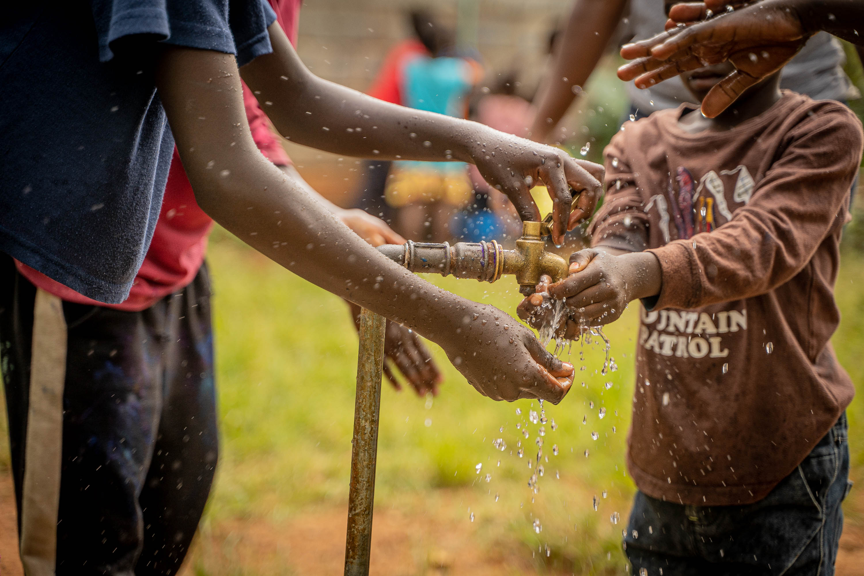 African children washing hands Photo by Well Aware