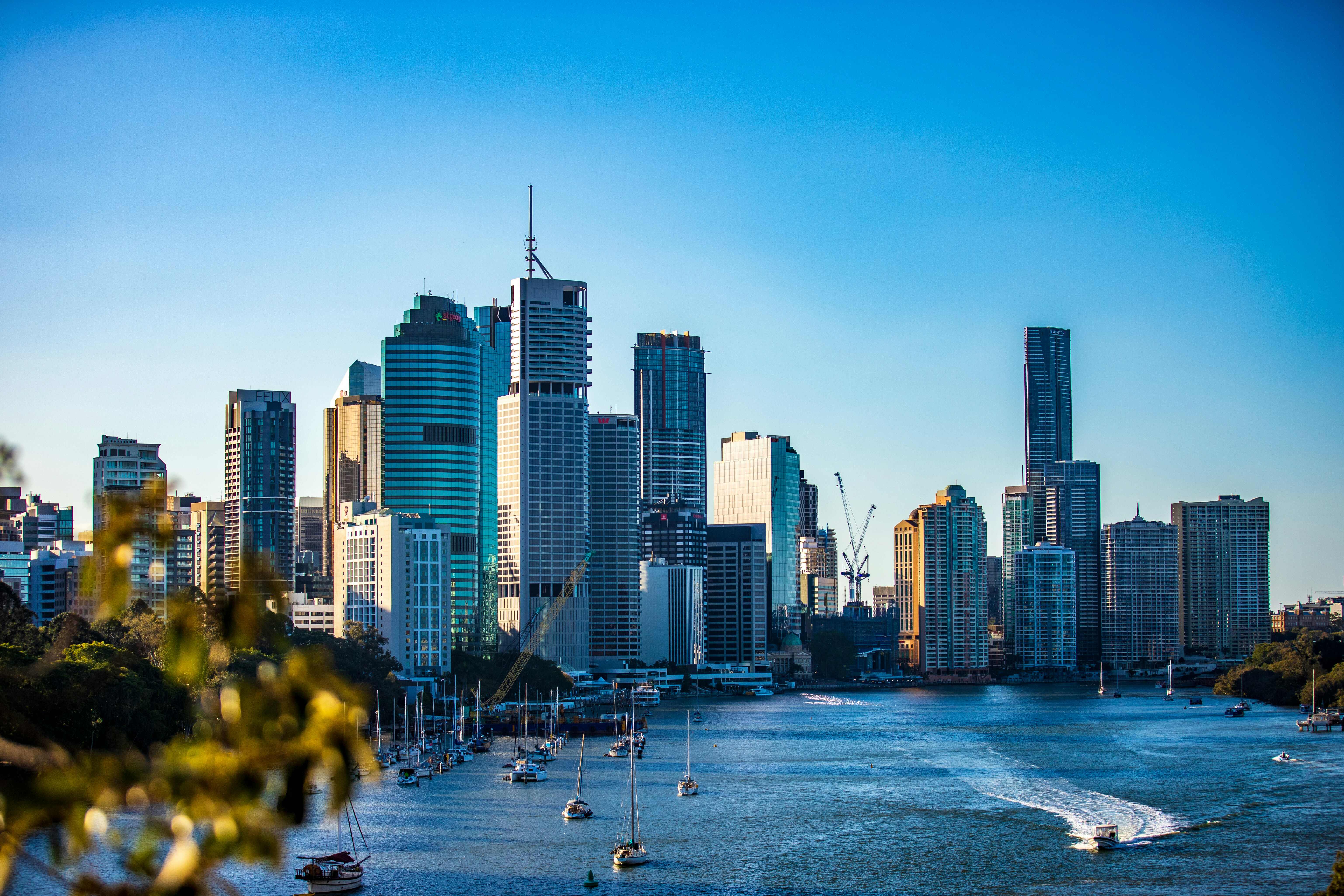 Brisbane city skyline under clear bear sky during daytime